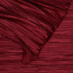 Close up view of Cahaya pleated tablecloth in red.