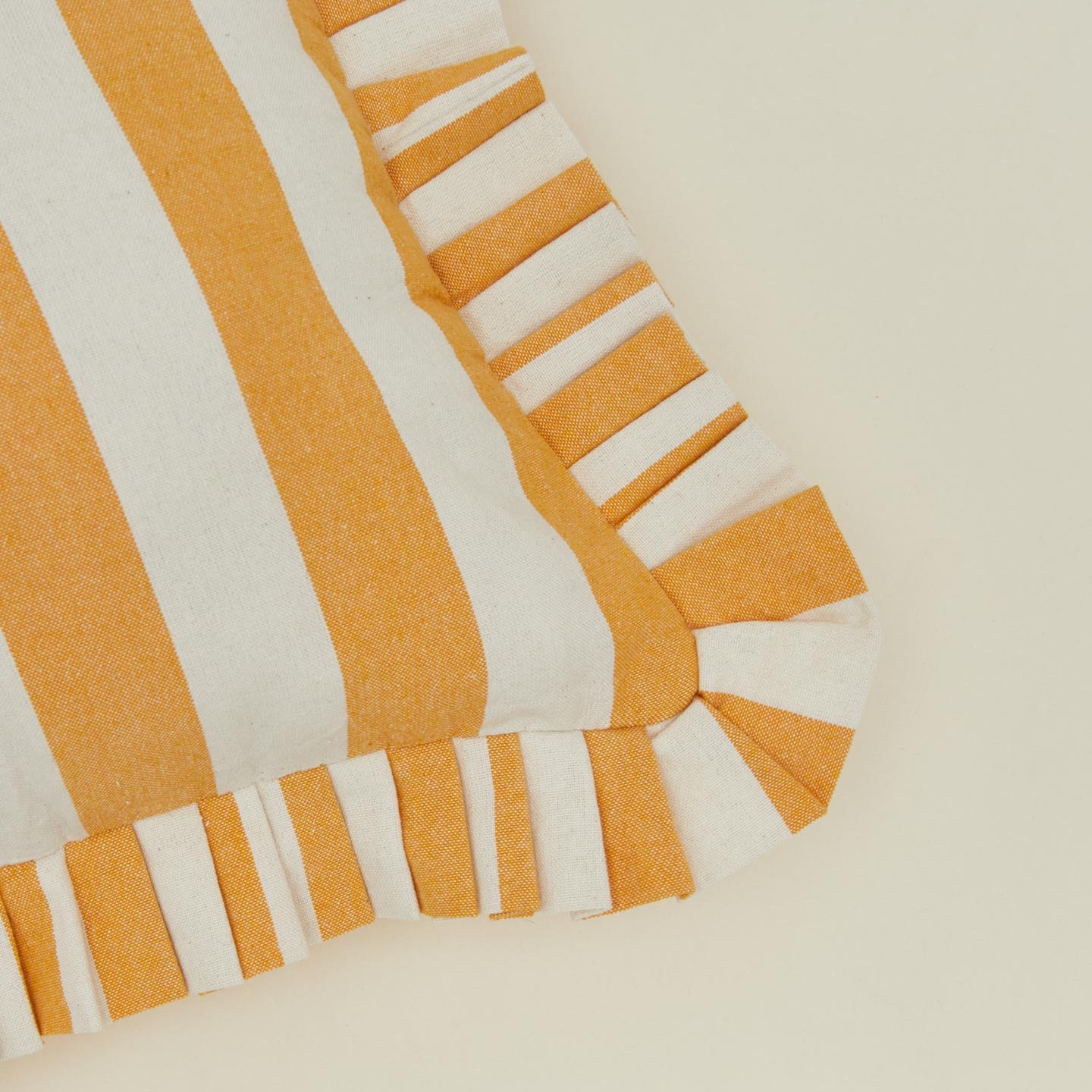 Close up view of Cabana Stripe Cushion in gold