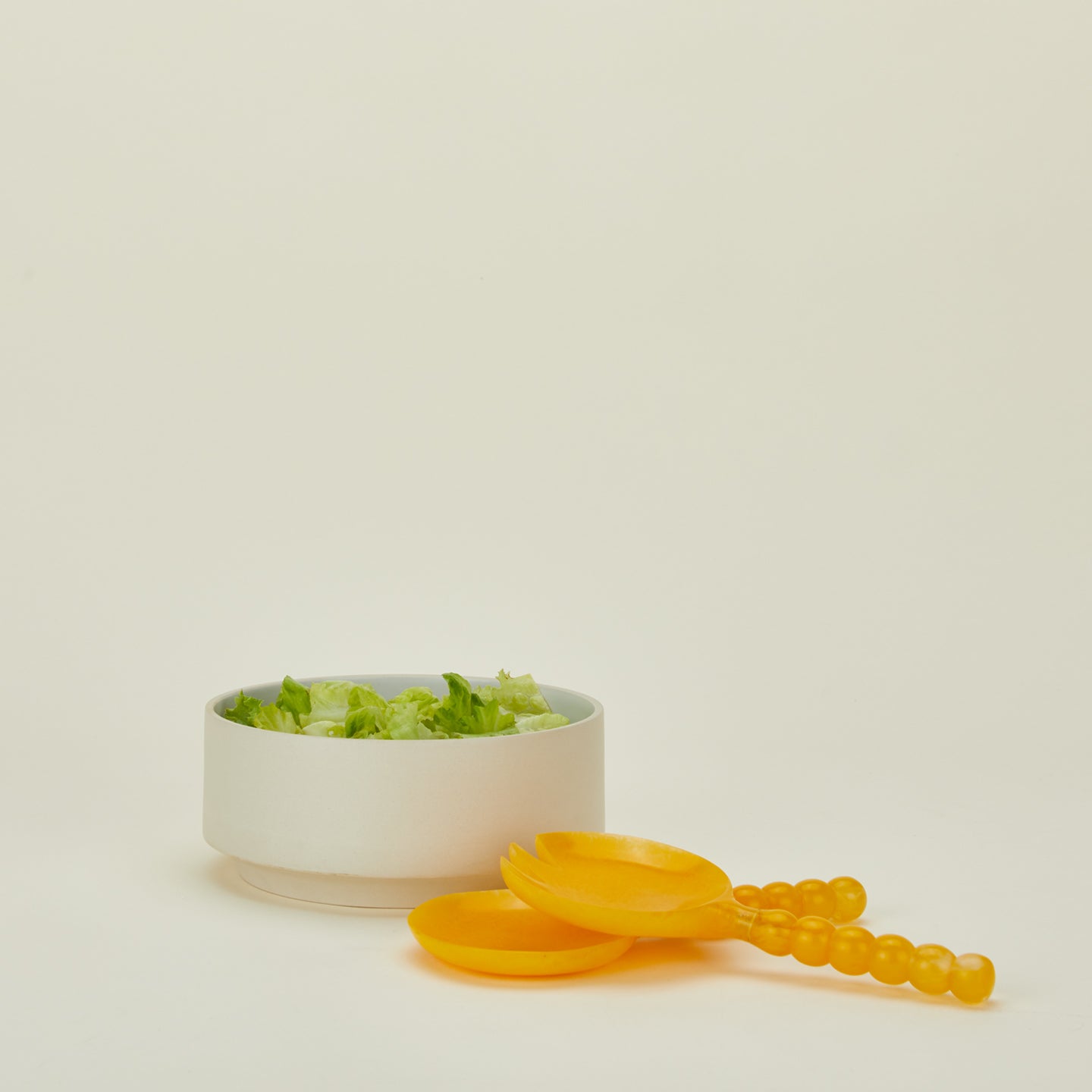 Lemon Yellow Salad Servers with salad in bowl