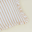 Detail of block printed striped ruffled pillow in Tan.