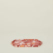 Set of two nested hexagon marbled trays in warm tones.
