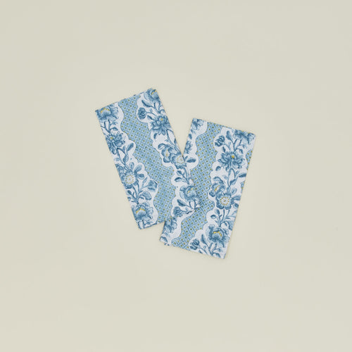 A set of two block printed napkins with a floral pattern in indigo.