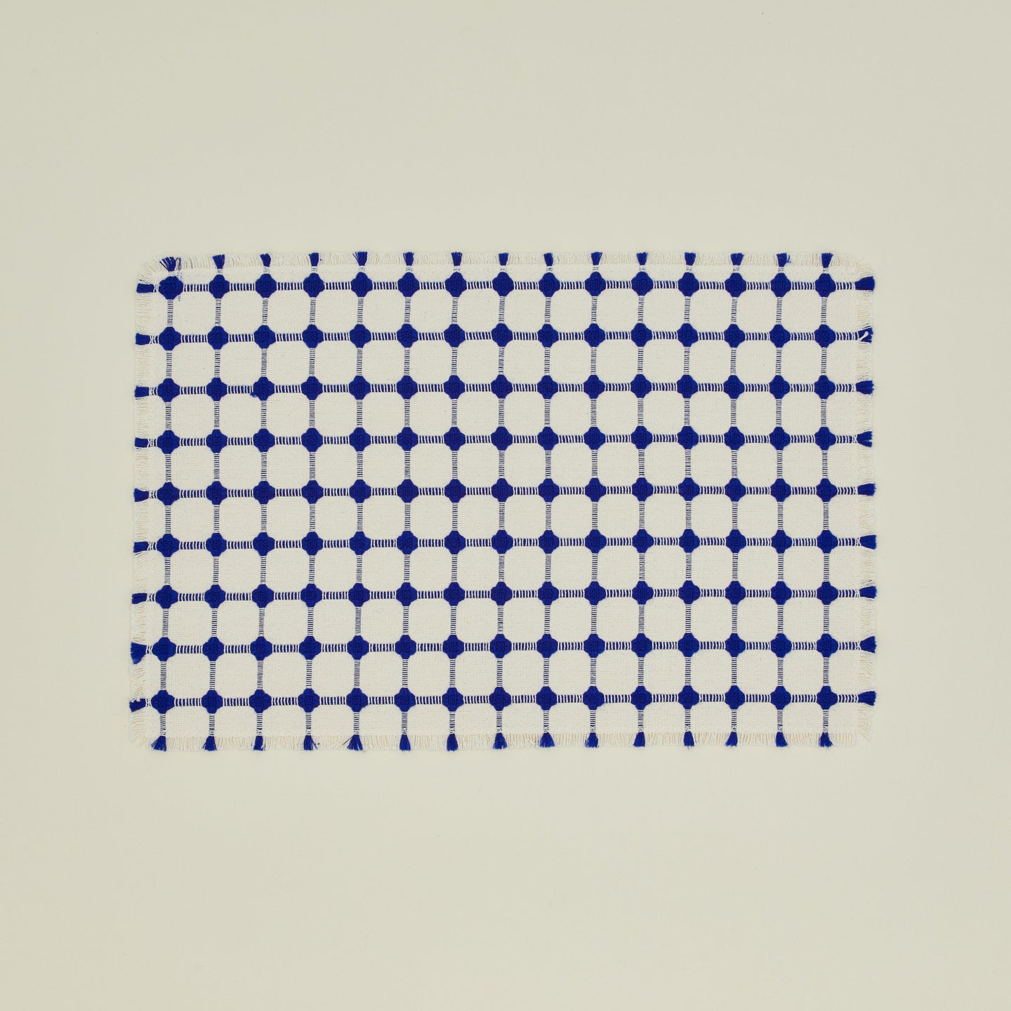 Dove and Donkey wicker fringed placemat in cobalt