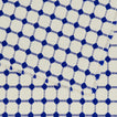 Close up view of Dove and Donkey wicker fringed placemat in cobalt