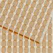 Close up view of Dove and Donkey hopsack placemat in honey