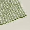 Close up view of Dove and Donkey hopsack napkin in leaf