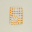 Dove and Donkey wicker fringed tablecloth in marigold