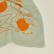 Close up view of clementine tea towel