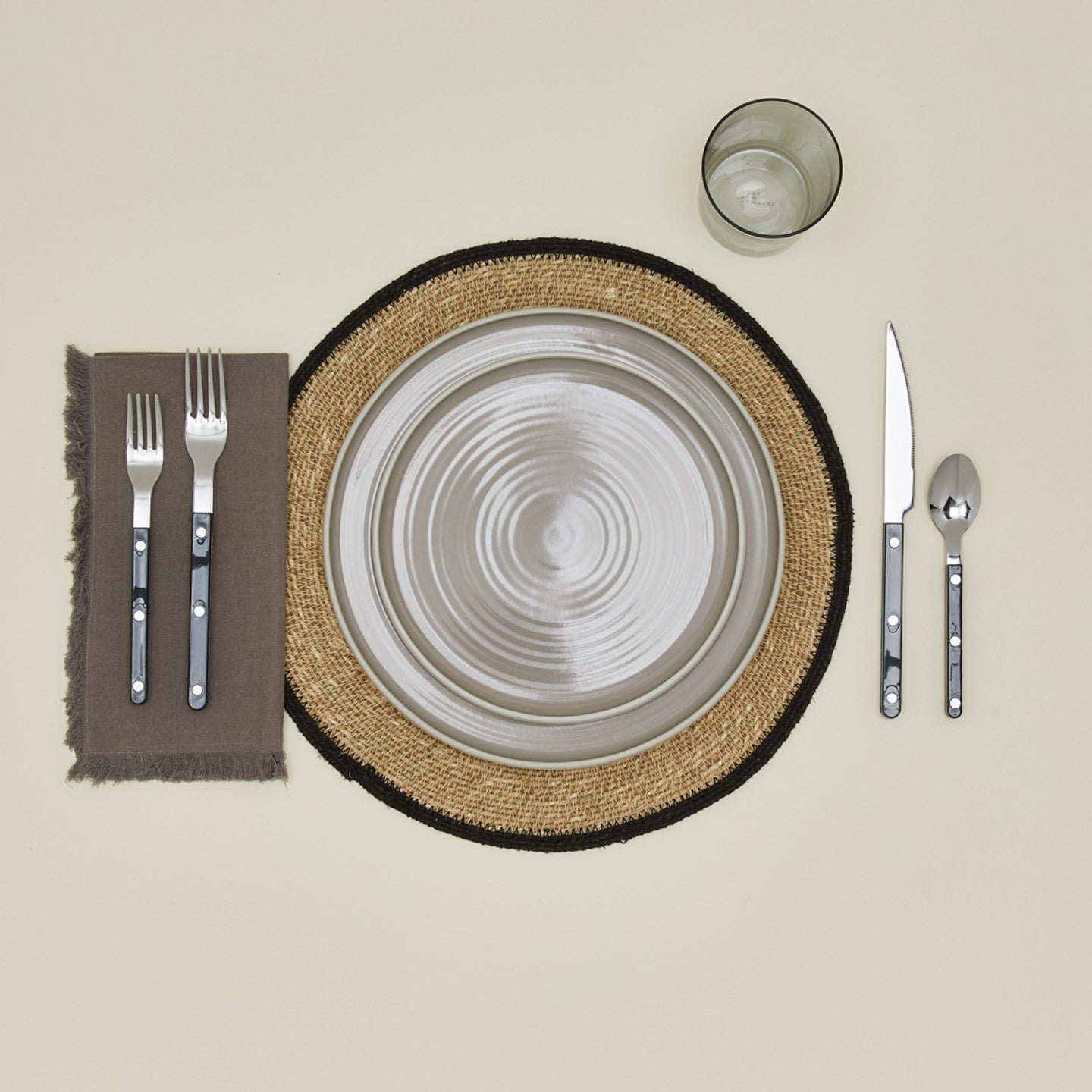 Essential Woven Placemat in black with place setting