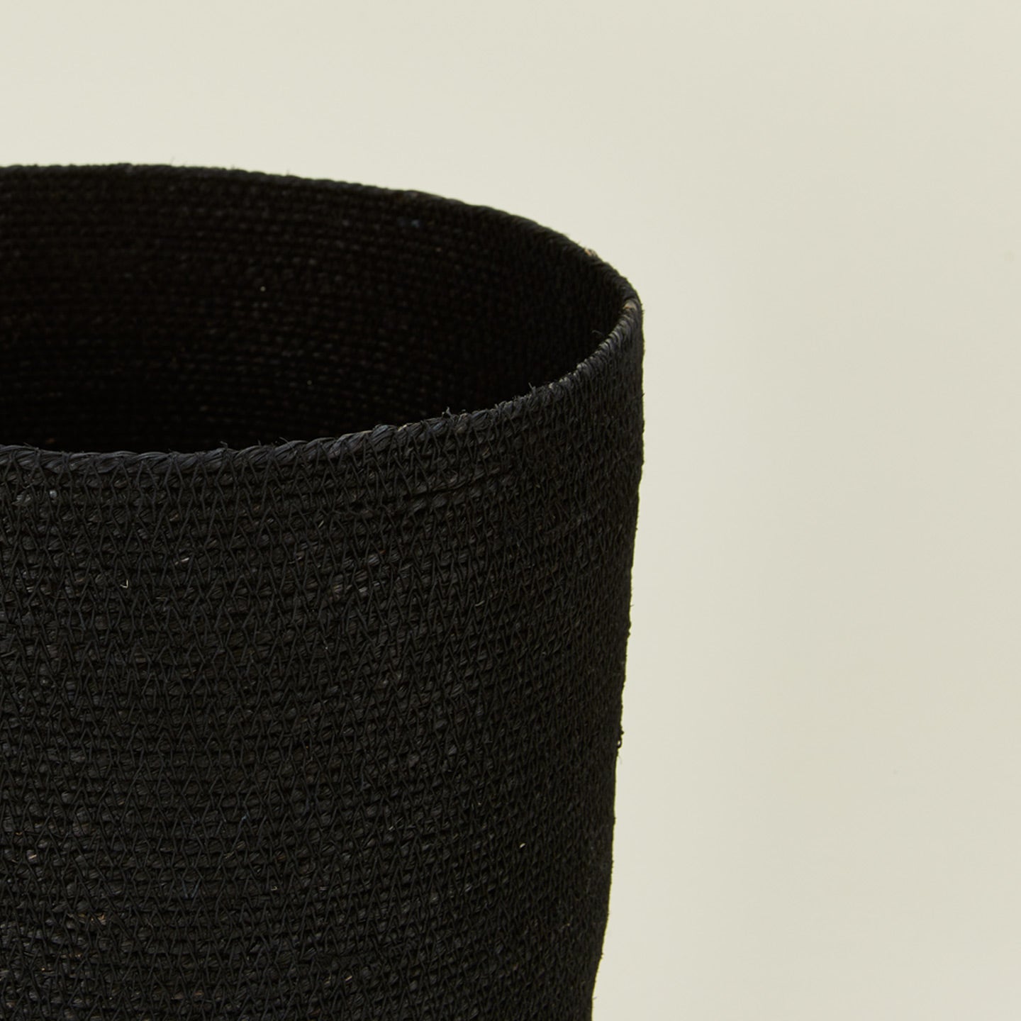Close up of Essential woven wastebasket in black