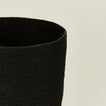 Close up of Essential woven wastebasket in black