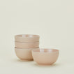 Four blush pink Essential Large Bowls.