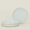 Four bone white Essential Dinner Plates.