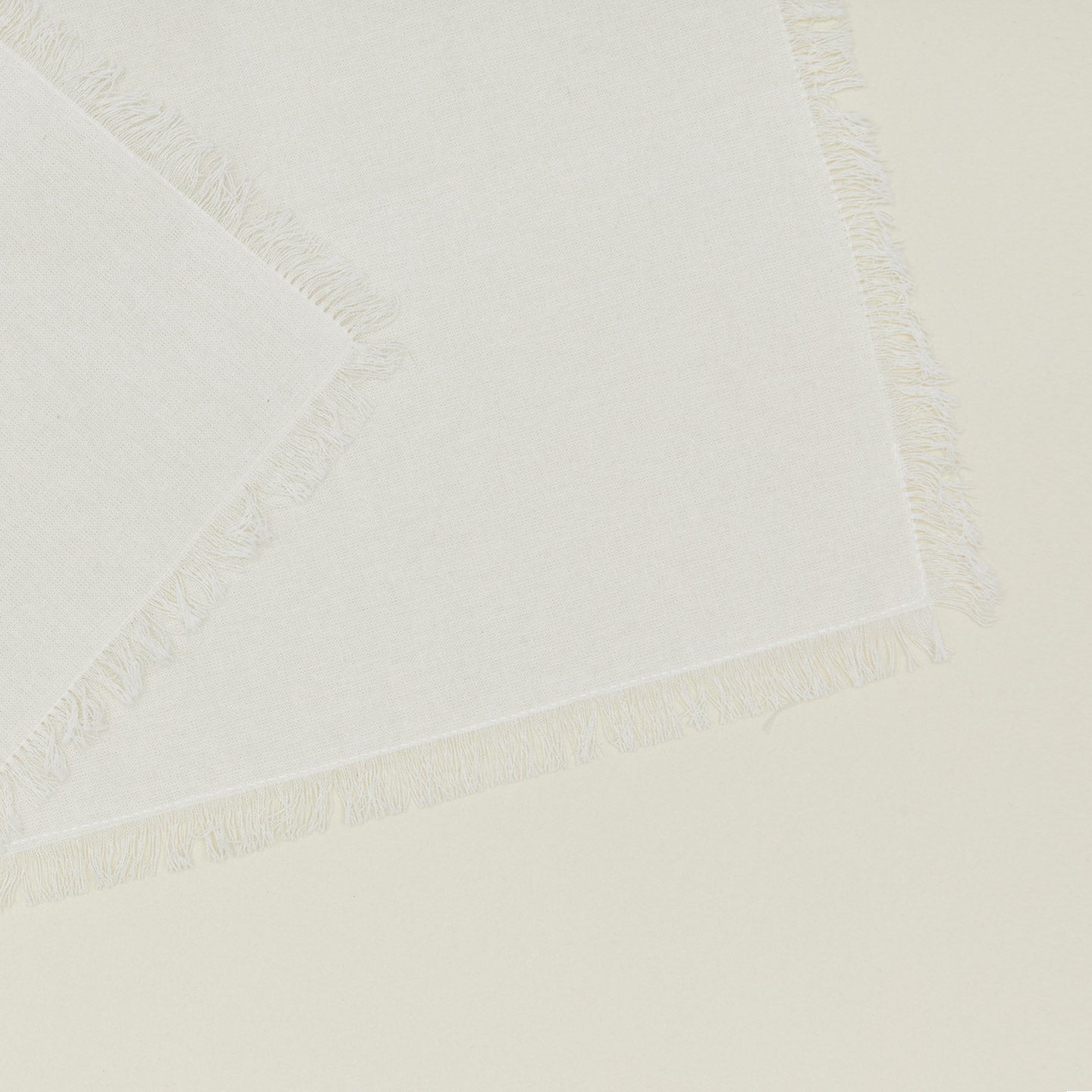 Close up view of essential cocktail napkin in ivory
