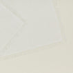 Close up view of essential cocktail napkin in ivory