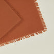 Close up view of essential cocktail napkin in terracotta