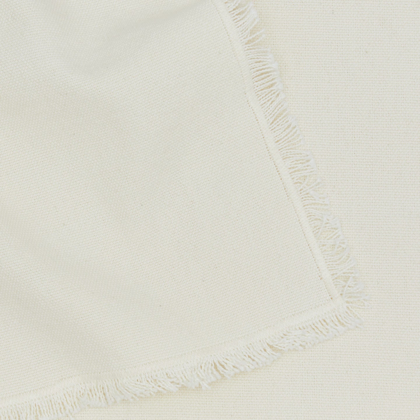 Close up view of essential cotton placemat in ivory