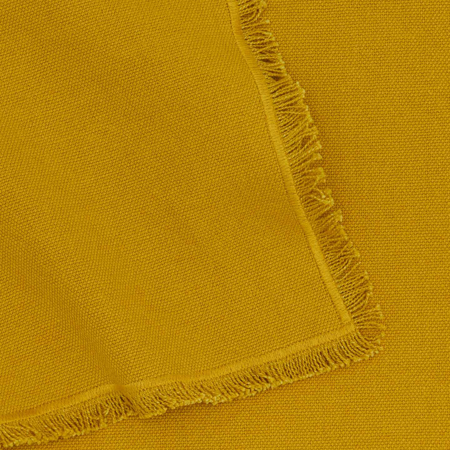 Close up view of essential cotton placemat in mustard