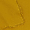 Close up view of essential cotton placemat in mustard