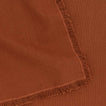 Close up view of essential cotton placemat in terracotta
