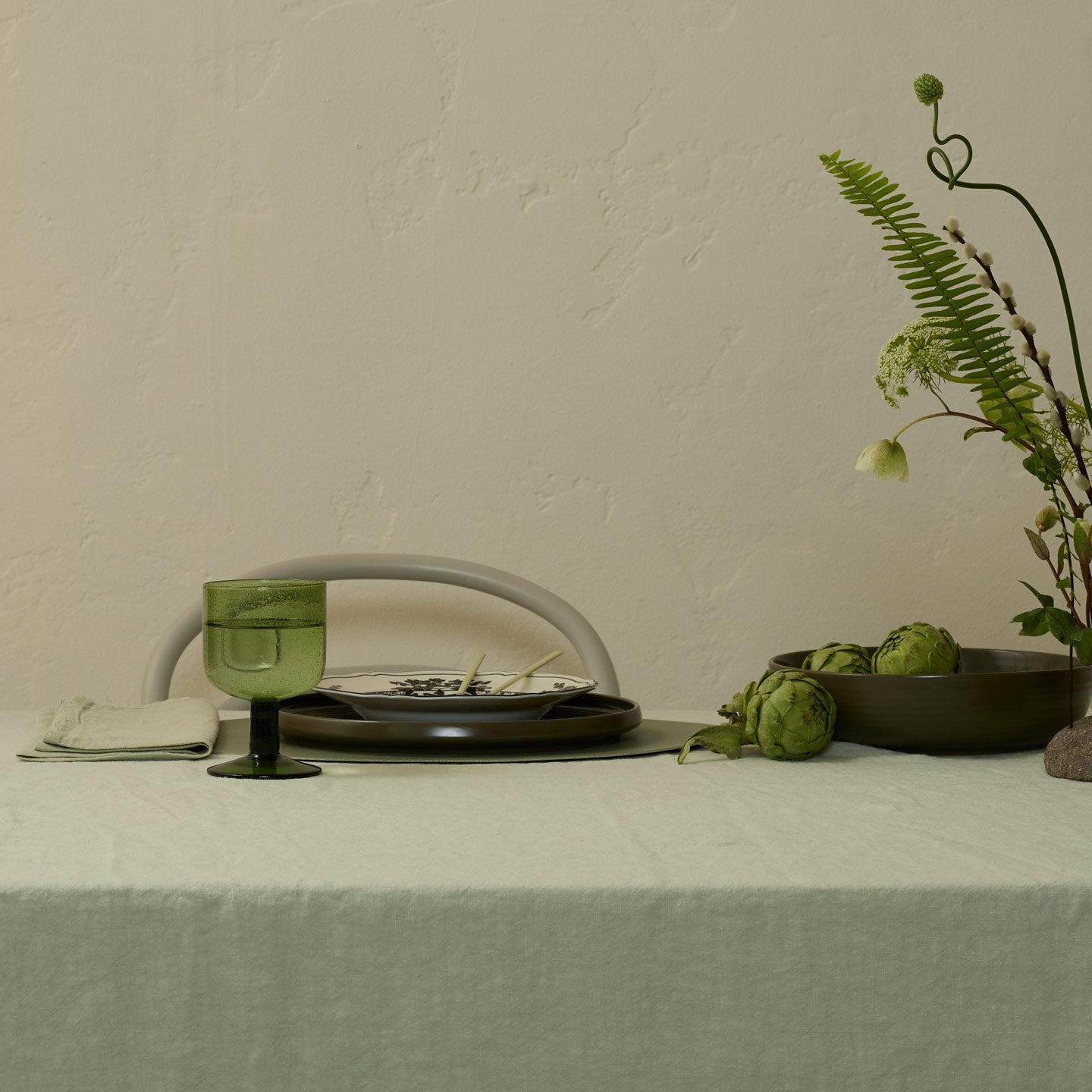 Place setting in green hues with Olive Simple Seeded Glass.