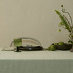 Place setting in green hues with Olive Simple Seeded Glass.