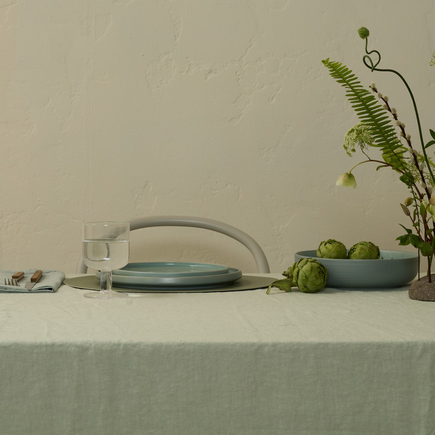 Blue tablescape with Simple Seeded Glass in Clear with water.