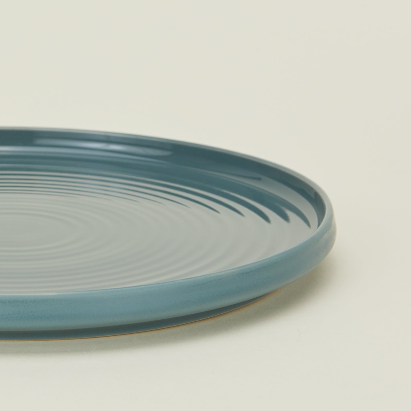 Close up view of essential dinnerware salad plate in peacock