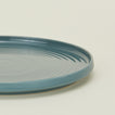 Close up view of essential dinnerware salad plate in peacock