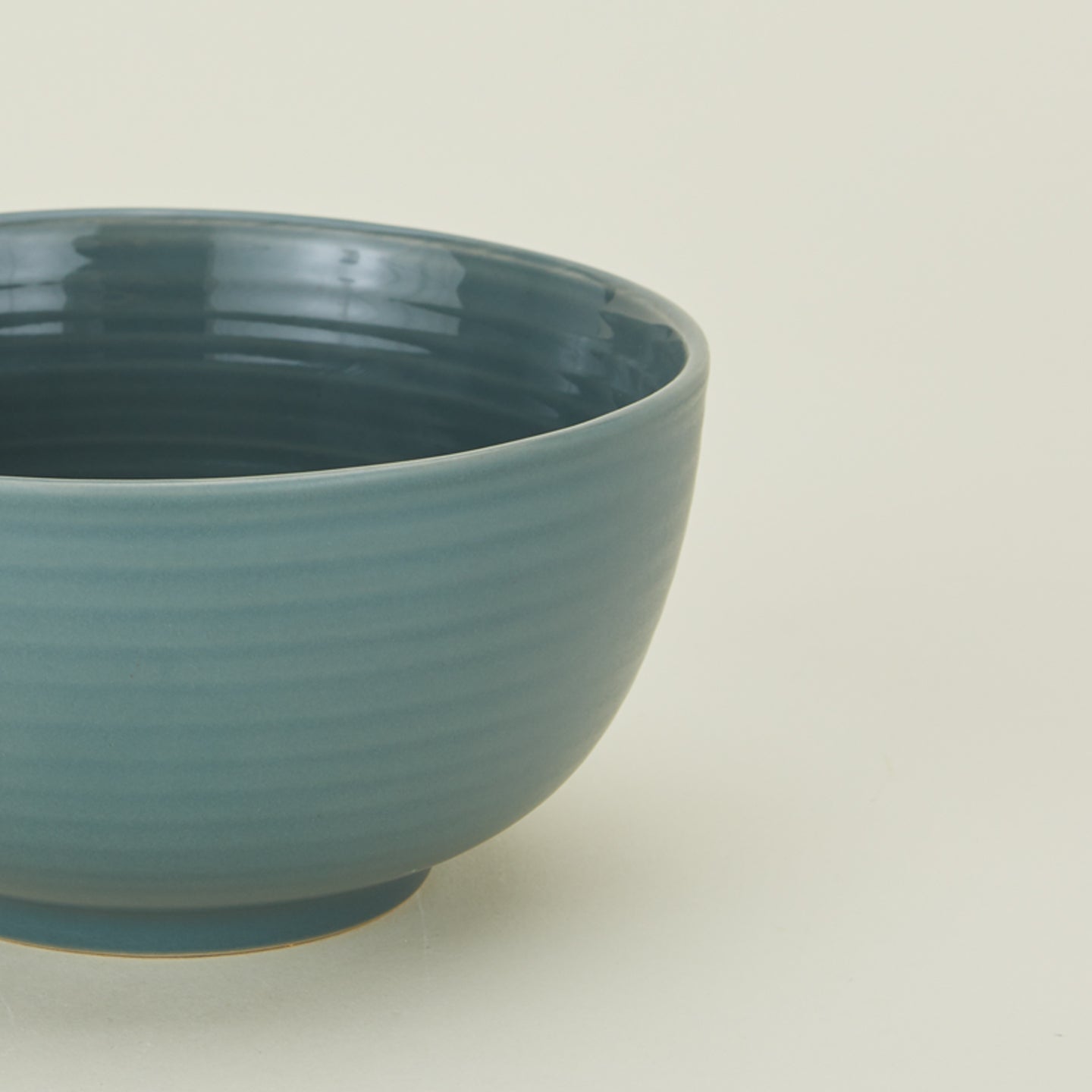 Close up view of essential dinnerware large bowl in peacock