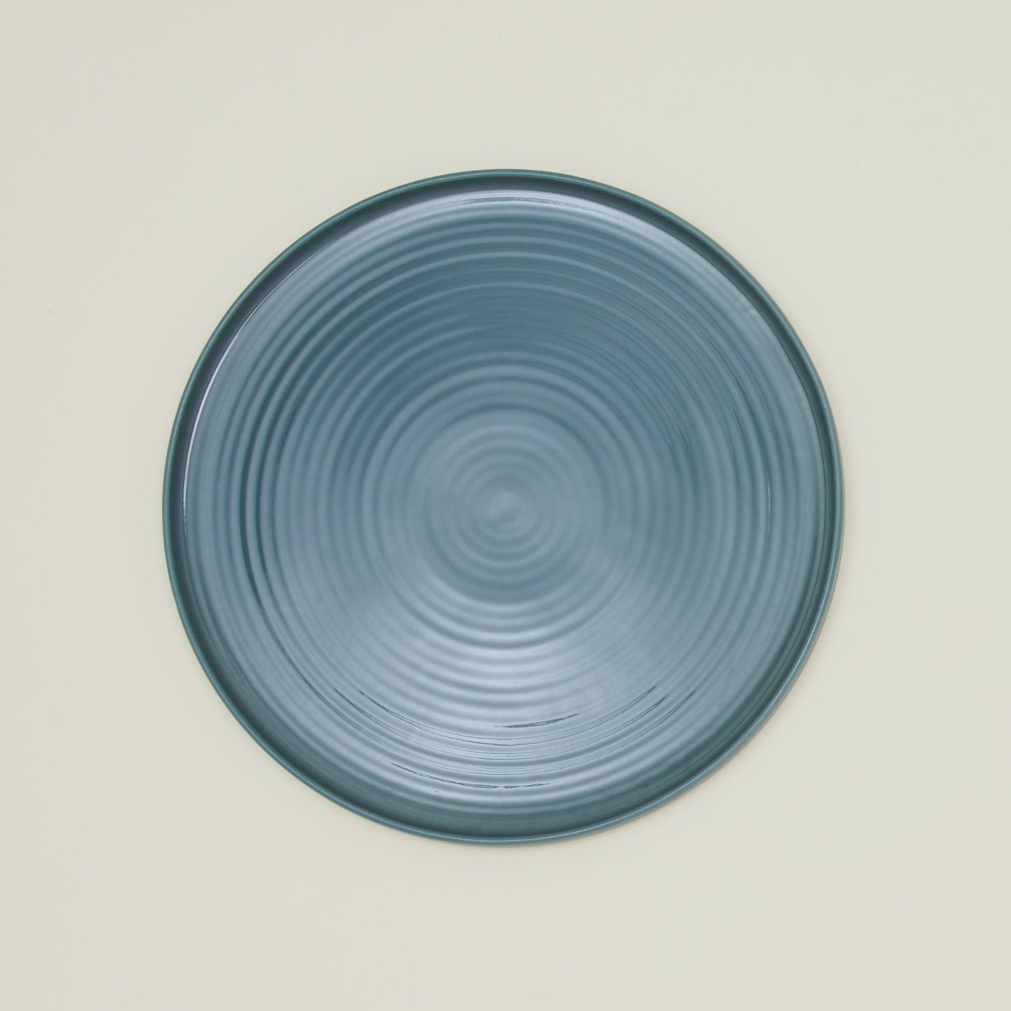 Overhead view of essential serving platter in peacock