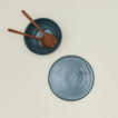 Overhead view of essential serveware set with wooden utensils