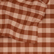 Close up view of Essential Gingham tablecloth in blush/terracotta