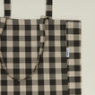 Close up view of gingham tote in grey/black