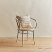 Essential gingham pillow in ivory/flax on chair