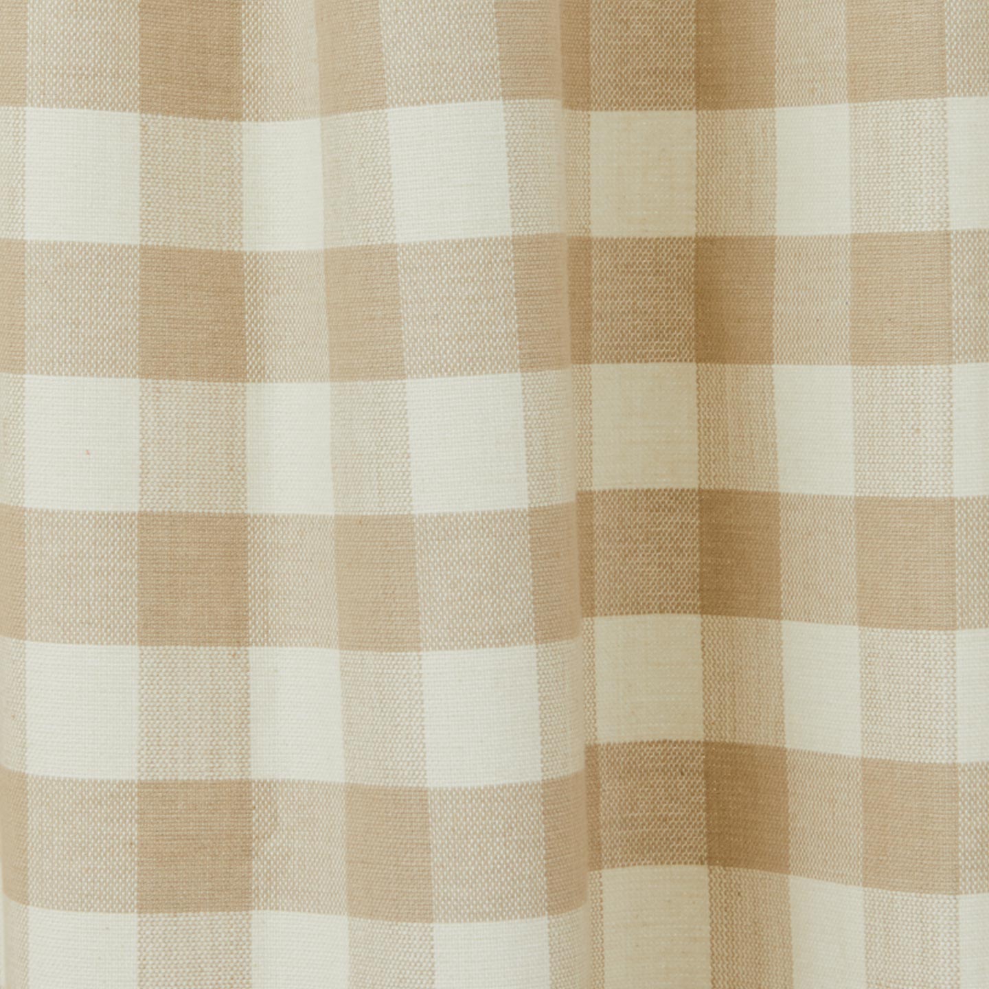 Close up view of gingham shower curtain in ivory/flax
