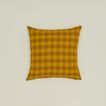Gingham square pillow in mustard/bronze