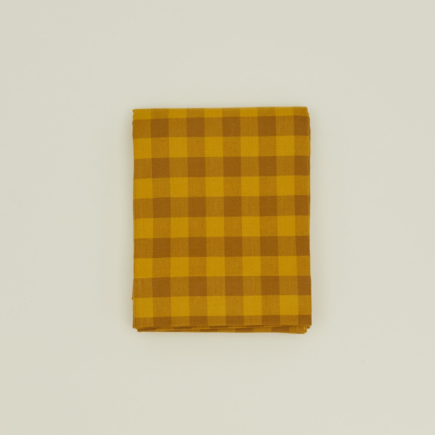 Gingham shower curtain in mustard/bronze