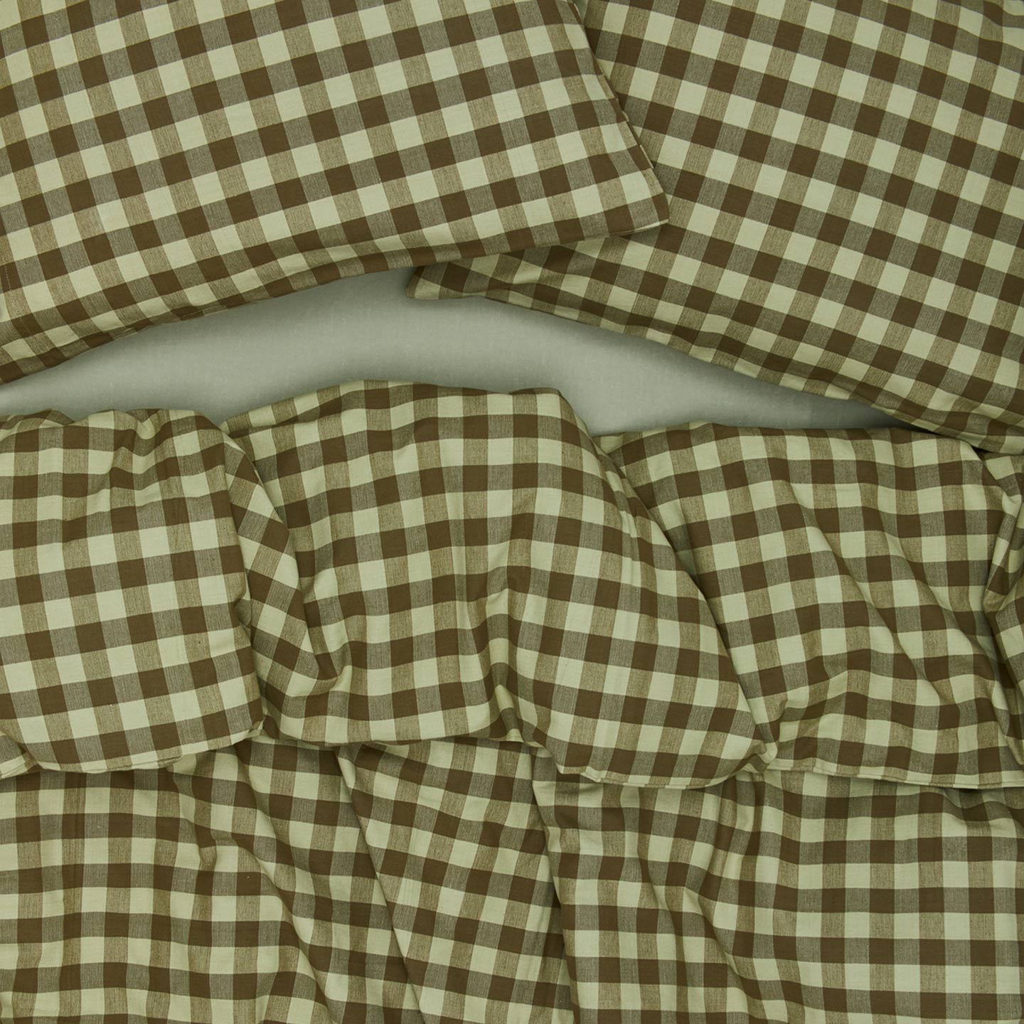Essential Gingham Pillowcases, Set of 2 - Sage/Olive on bed with matching duvet cover