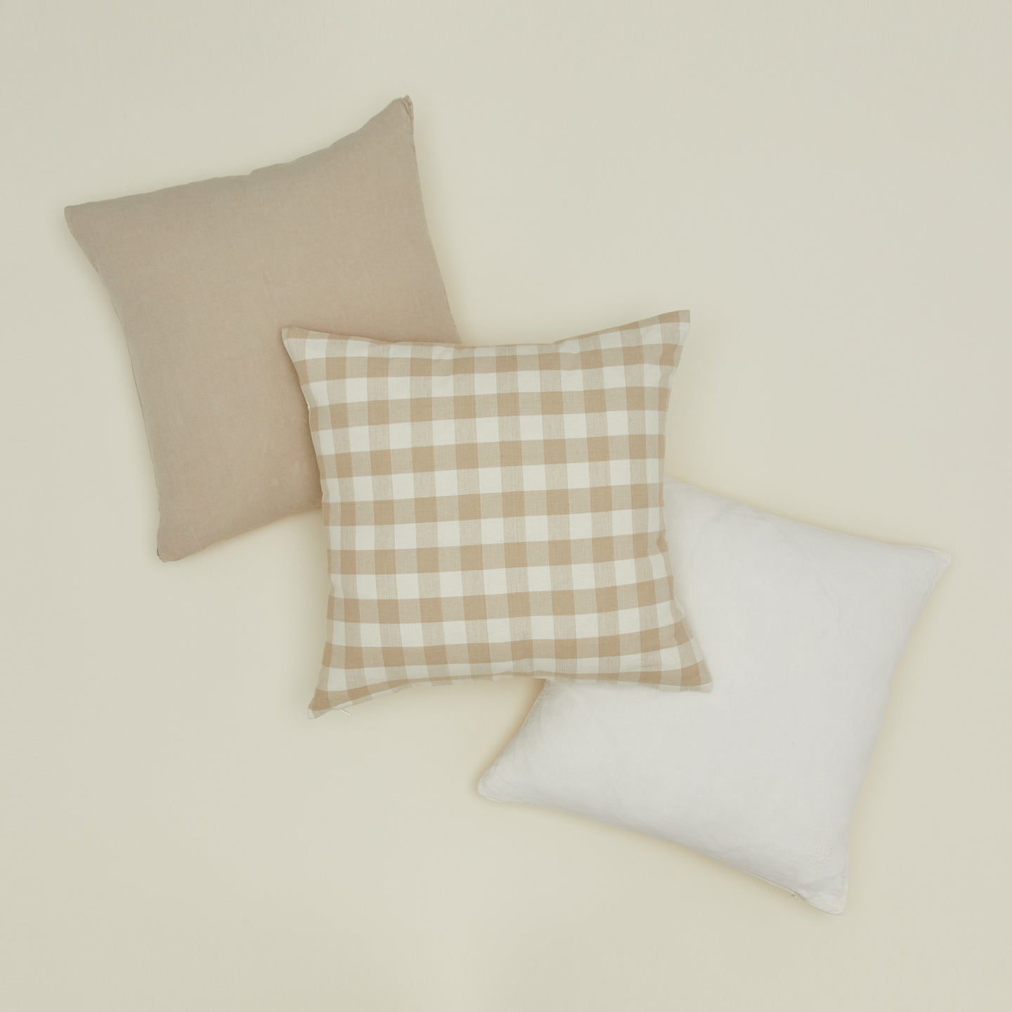 Essential gingham pillow and simple linen pillows in ivory and flax