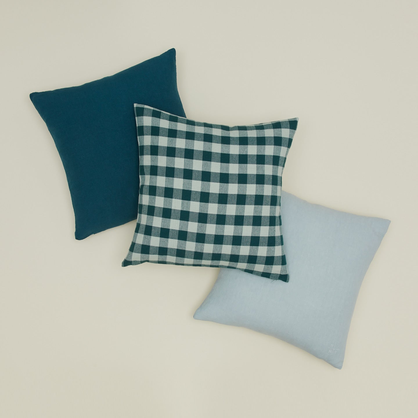 Essential gingham pillow in sky / peacock with simple linen pillows in peacock and sky