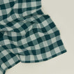 Close up view of Essential Gingham napkin in sky/peacock
