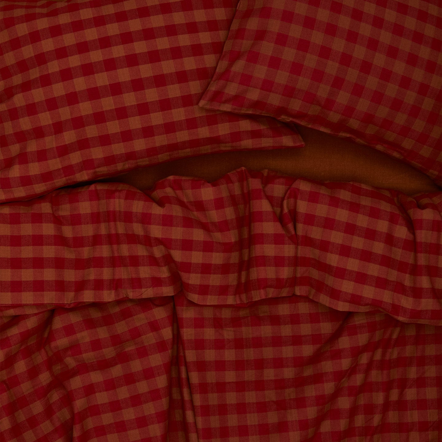 Essential Gingham Duvet - Terracotta/Red on bed with matching pillow cases