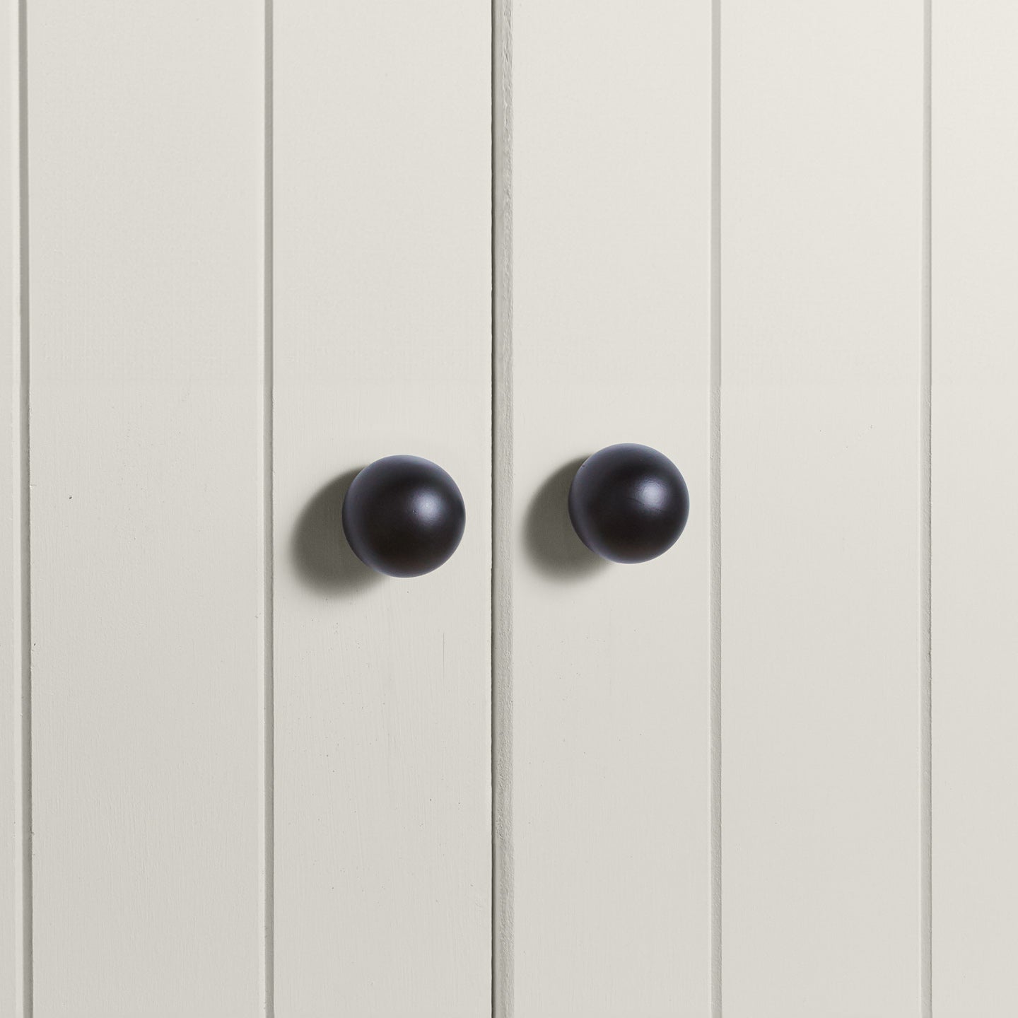 Large back essential sphere knobs on white doors