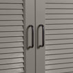 Small black pulls on louvered doors