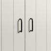 Small black pulls on white doors