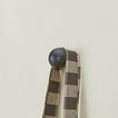 Essential sphere hook in black with hanging tote bag