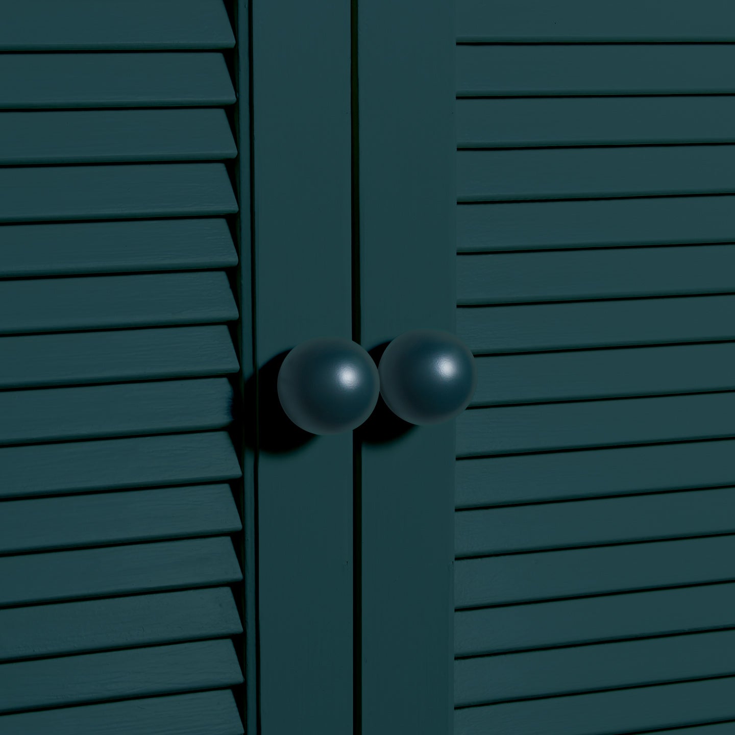 Large peacock essential sphere knobs on louvered doors