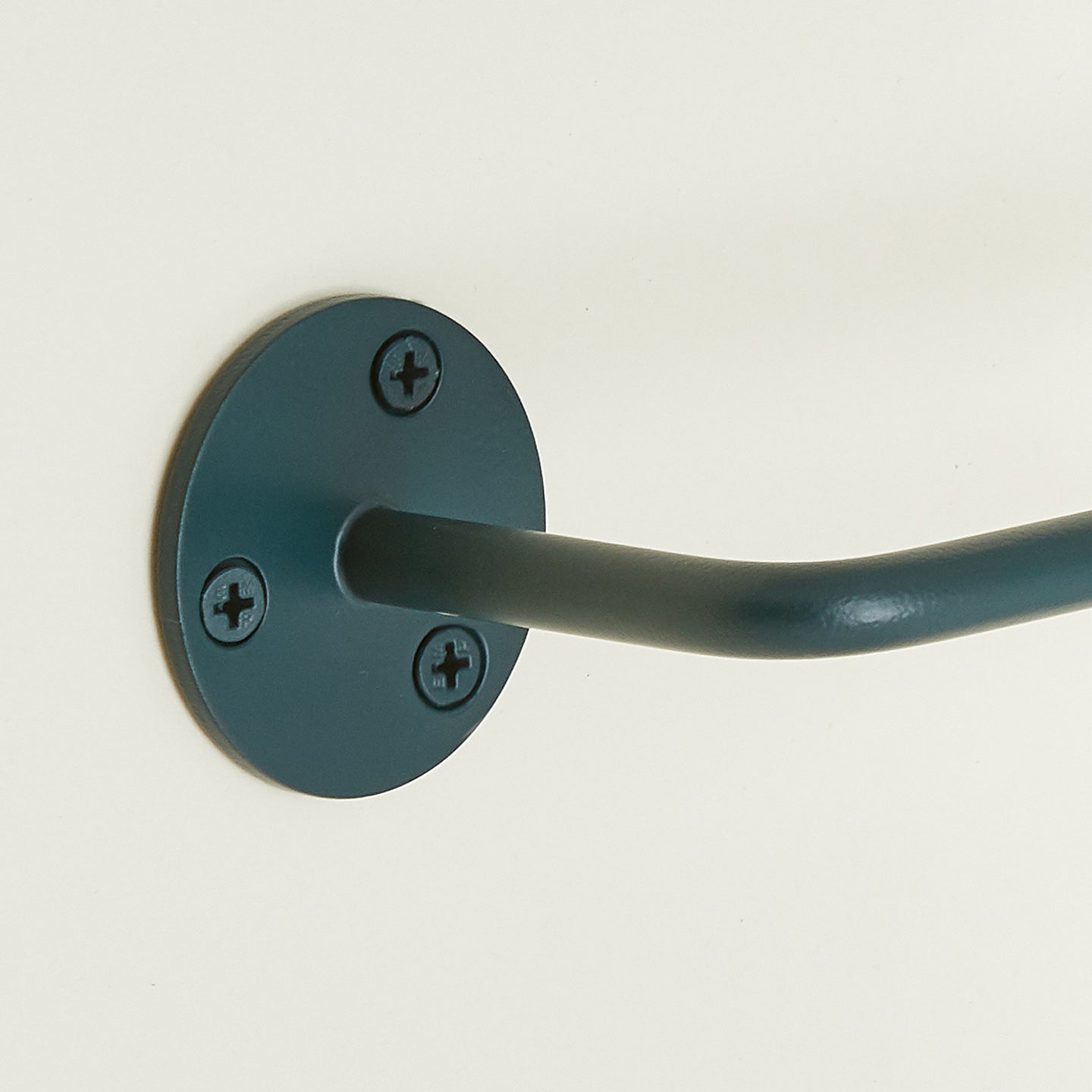 Close up of toilet paper holder in Dark Peacock