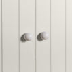 Large ivory essential sphere knobs on white doors